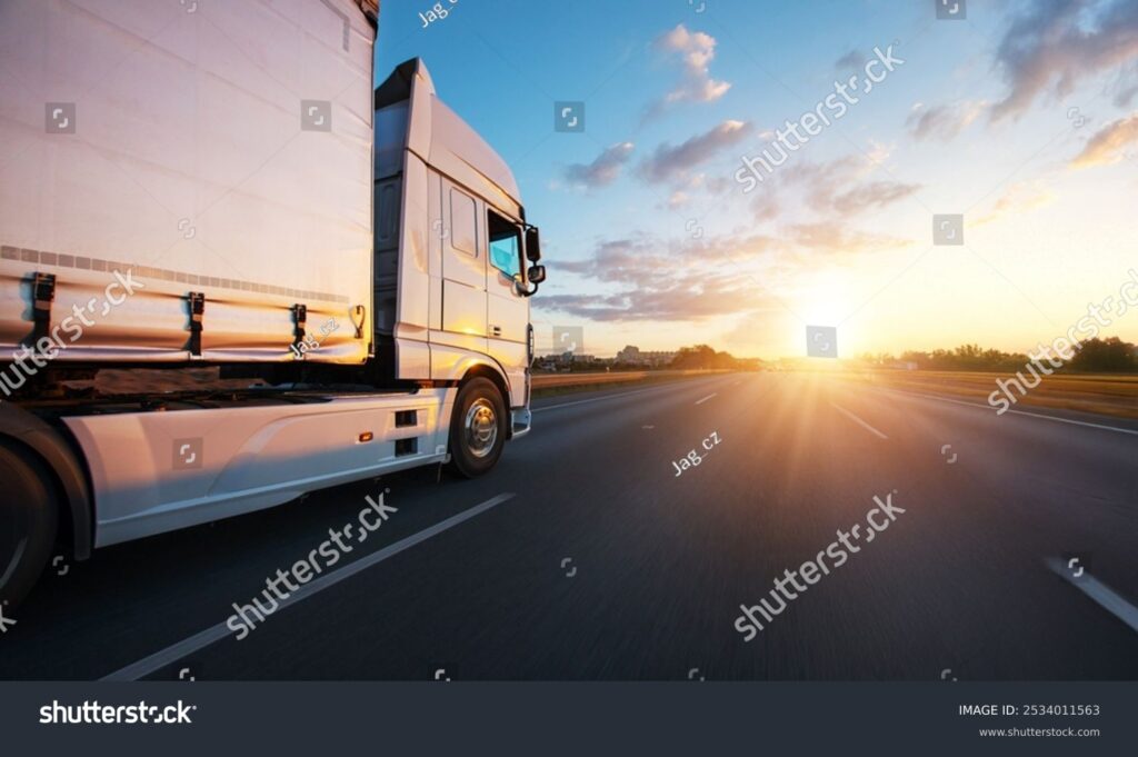 stock photo european truck driving on the asphalt road in rural landscape at sunset transportation and cargo 2534011563