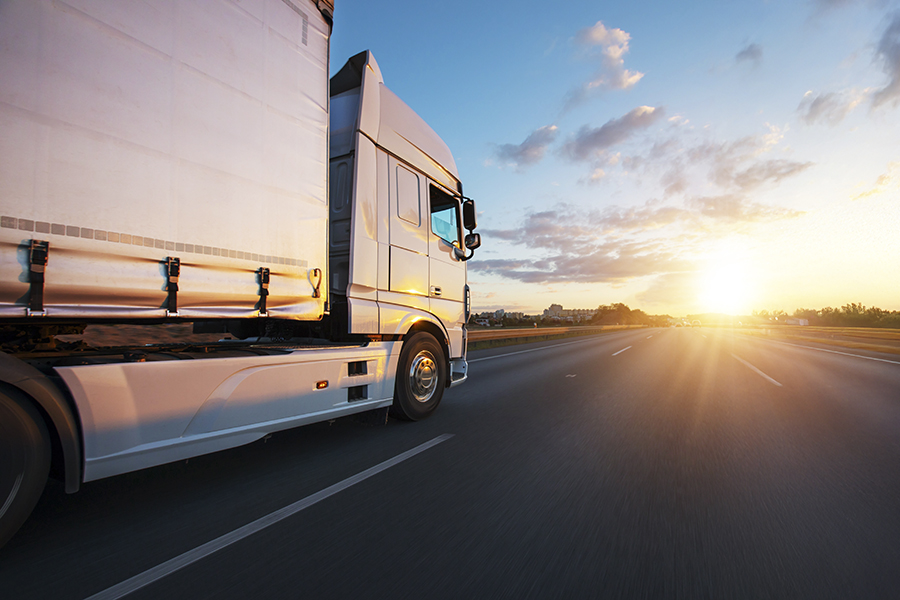 european,truck,driving,on,the,asphalt,road,in,rural,landscape